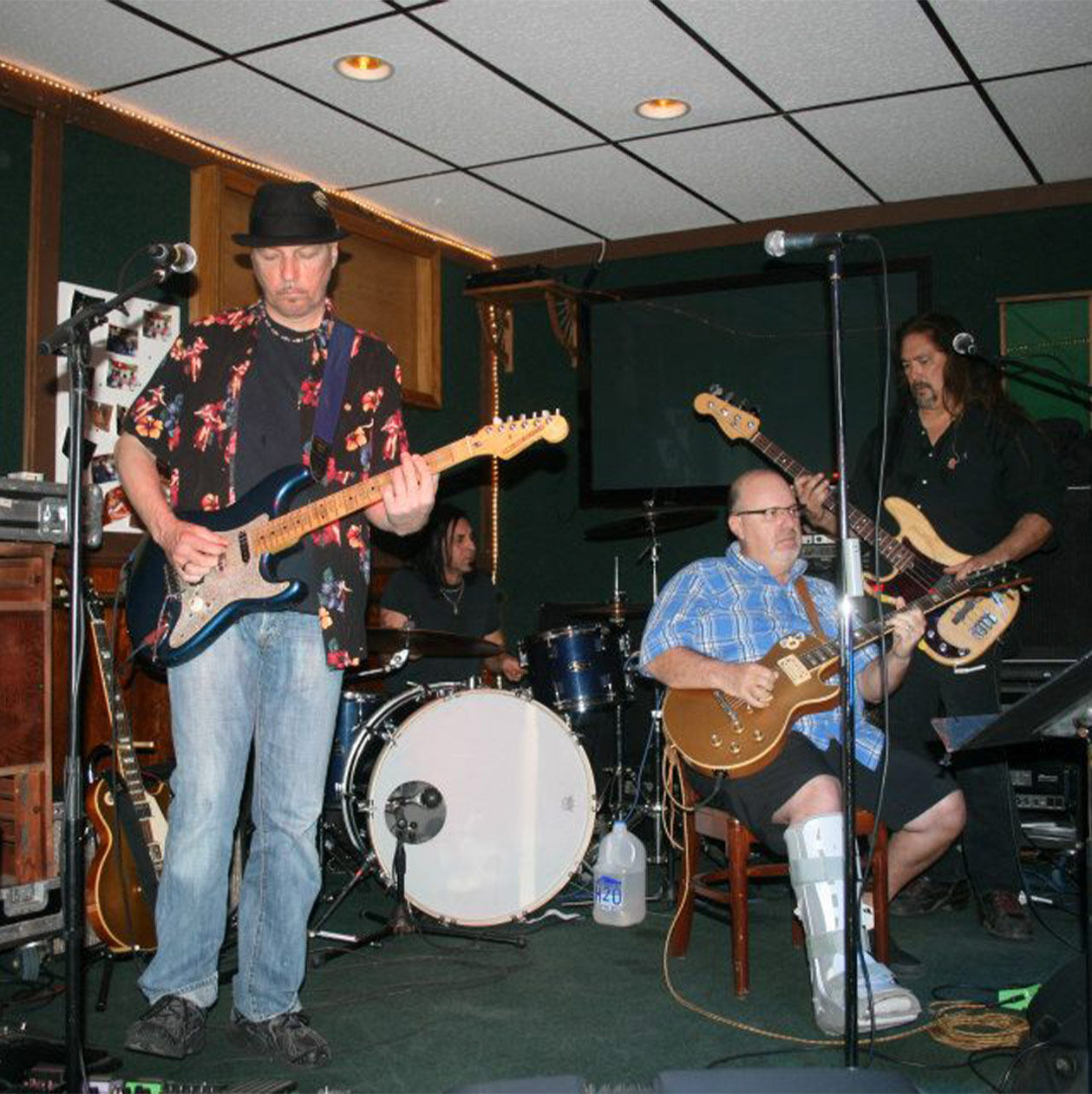 The band playing music on a small stage
